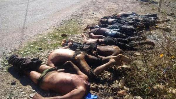 Los cuerpos calcinados y descuartizados que en un principio hicieron pasar por los de los estudiantes desaparecidos, pero luego se comprobó que no lo eran.