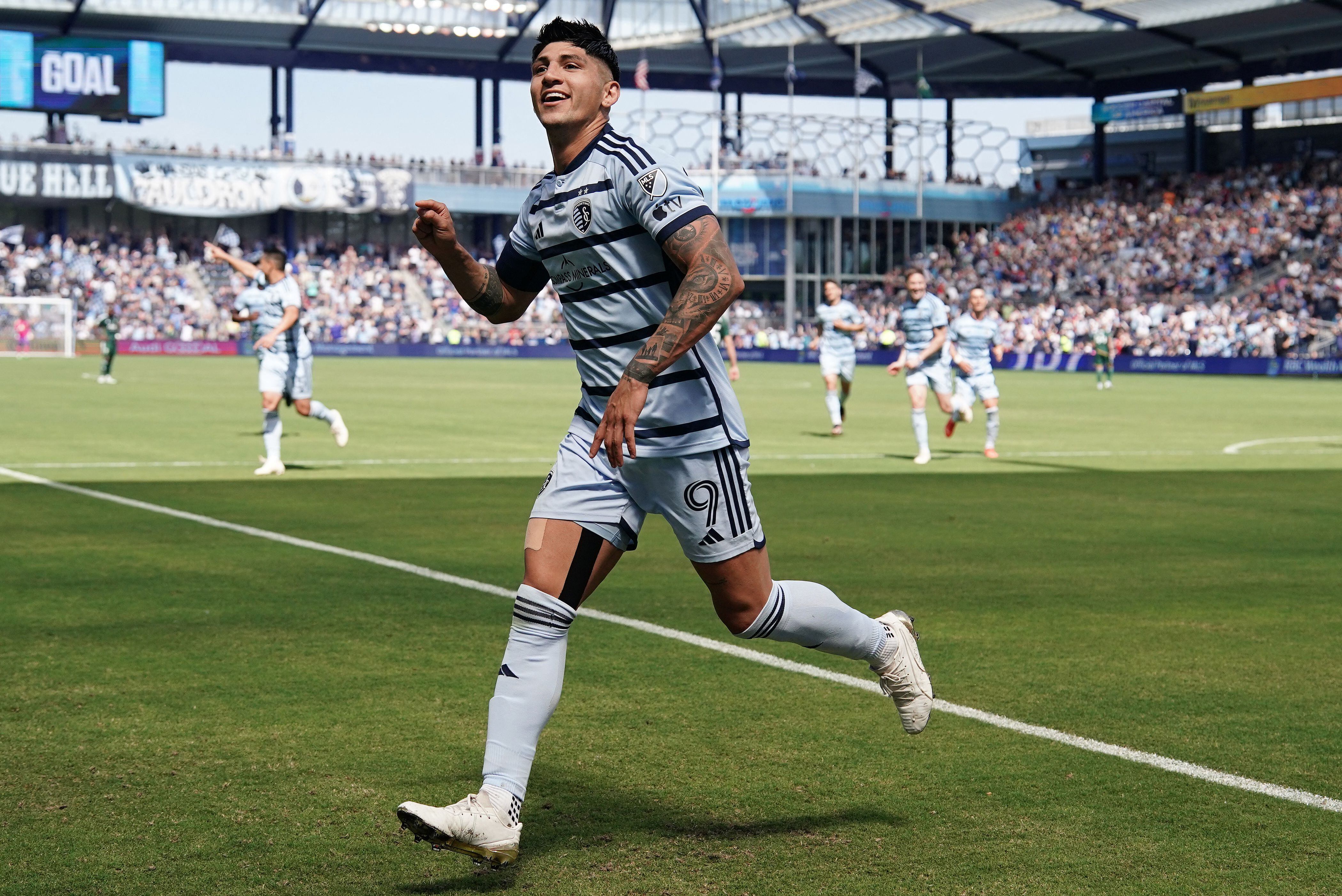 May 28, 2023; Kansas City, Kansas, USA; Sporting Kansas City forward Alan Pulido (9) celebrates after a goal against the Portland Timbers during the second half at Children's Mercy Park. Mandatory Credit: Denny Medley-USA TODAY Sports