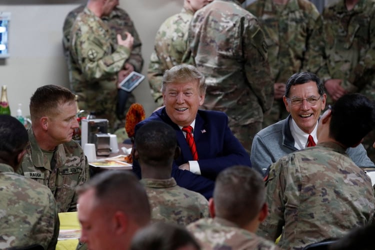 Donald Trump traveled by surprise to Afghanistan to share Thanksgiving dinner with US troops