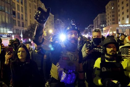 A member of the far-right group Proud Boys yells at police to let them through as they march on a street near the White House, during a rally to protest the results of the election, in Washington, U.S., December 12, 2020. REUTERS/Jonathan Ernst
