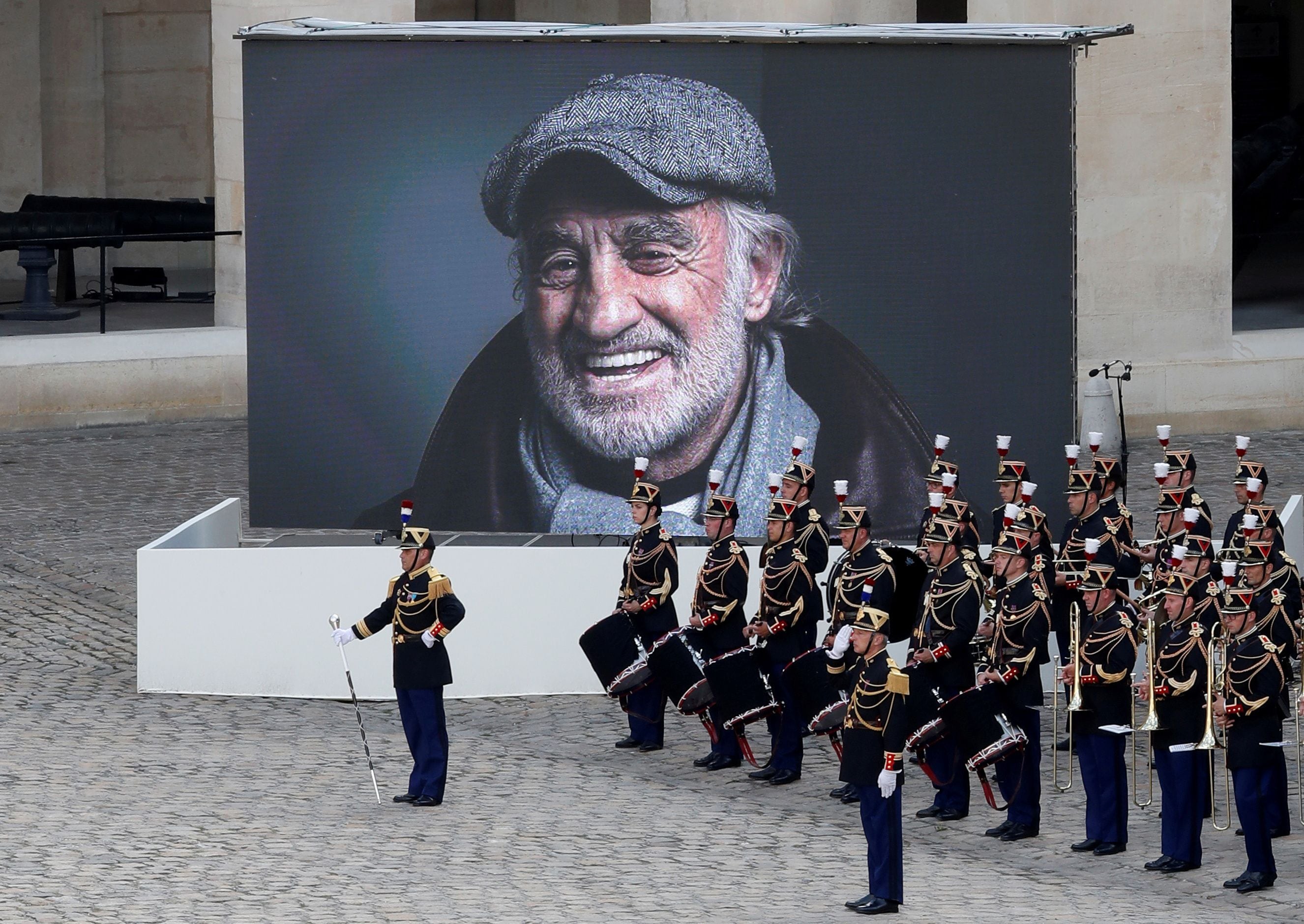 A photograph of the late actor Jean-Paul Belmondo is seen on a giant screen during a ceremony at the Hotel des Invalides in Paris, France, September 9, 2021. REUTERS/Eric Gaillard