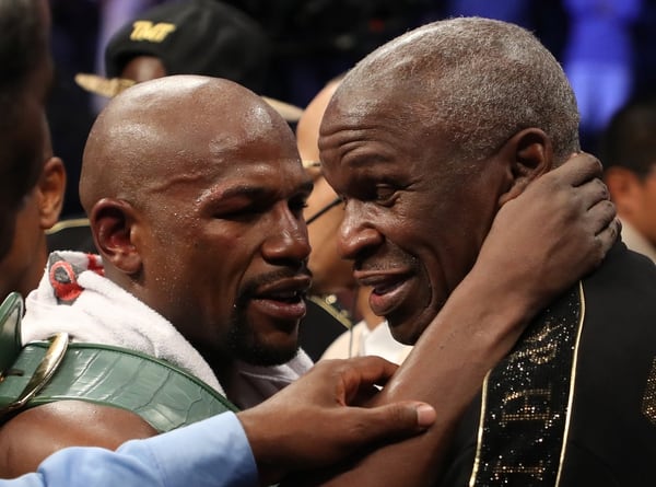 LAS VEGAS, NV – AUGUST 26: (L-R) Floyd Mayweather Jr. hugs Floyd Mayweather Sr. after defeating Conor McGregor by TKO in their super welterweight boxing match on August 26, 2017 at T-Mobile Arena in Las Vegas, Nevada. (Photo by Christian Petersen/Getty Images)