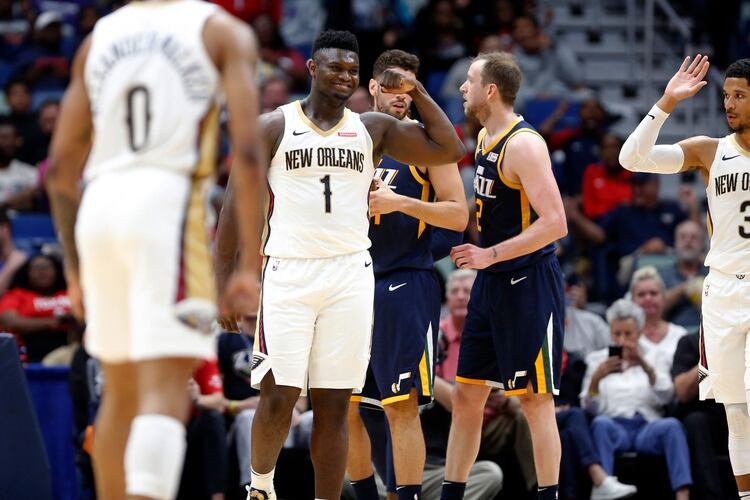 New Orleans Pelicans forward Zion Williamson (1) reacts after scoring a basket against the Utah Jazz in the second half of a preseason NBA basketball game in New Orleans, Friday, Oct. 11, 2019. The Pelicans won 128-127. (AP Photo/Tyler Kaufman)