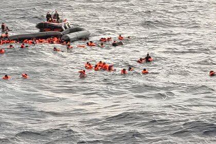A still image taken from a video shows migrants at sea waiting to be rescued by Spanish search and rescue ship Open Arms during a search and rescue (SAR) operation in the Mediterranean Sea, November 11, 2020. Open Arms/Handout via REUTERS ATTENTION EDITORS THIS IMAGE HAS BEEN SUPPLIED BY A THIRD PARTY. NO ARCHIVE. NO RESALE.