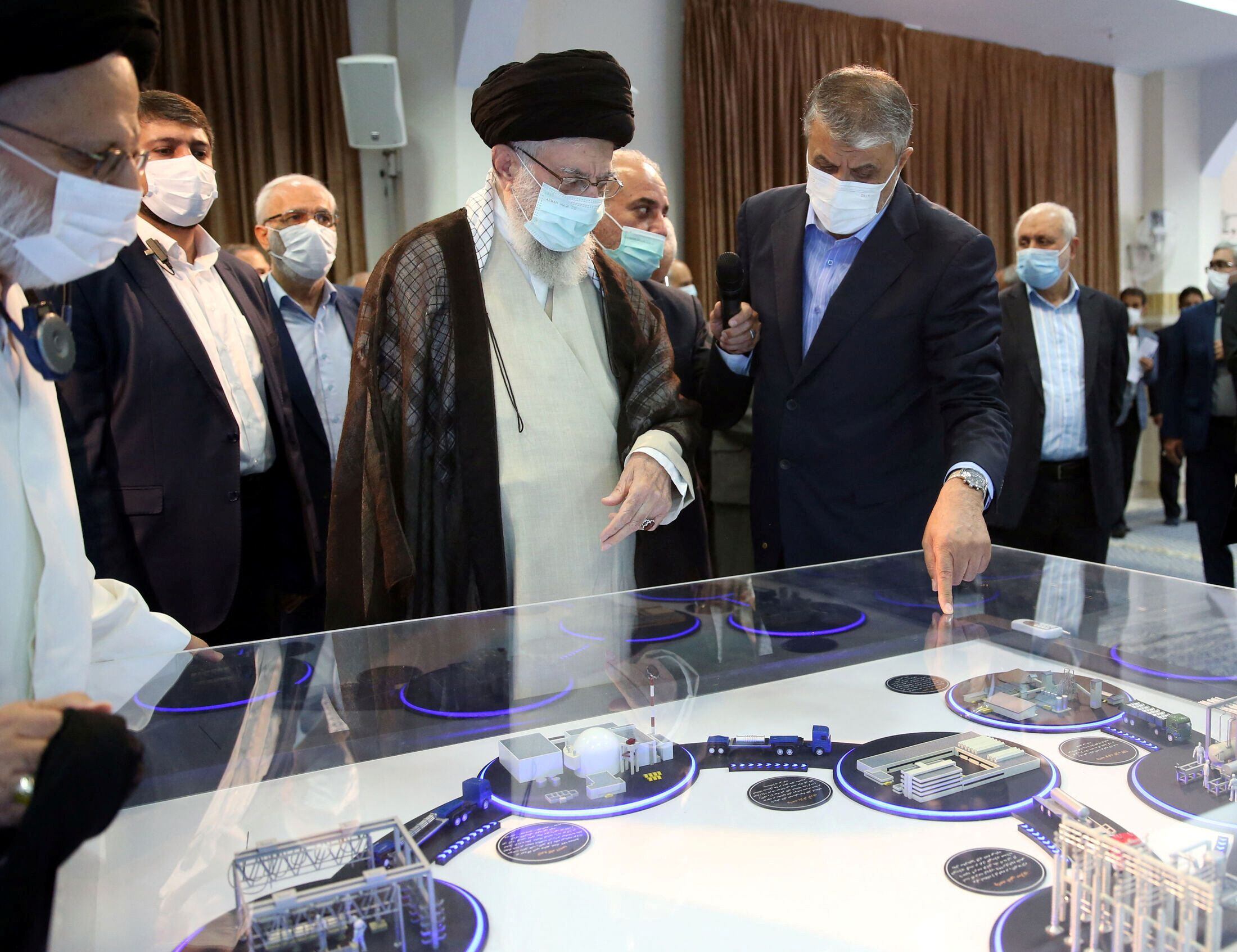 Iranian Supreme Leader Ayatollah Ali Khamenei looks at a mock-up of a nuclear facility in Tehran, Iran, June 11, 2023 (Reuters)