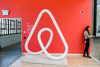 FILE PHOTO: A woman talks on the phone at the Airbnb office headquarters in the SOMA district of San Francisco, California, U.S., August 2, 2016.  REUTERS/Gabrielle Lurie/File Photo