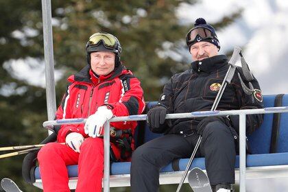 Russian President Vladimir Putin and Belarus President Alexander Lukashenko (R) take a ski-lift to the slopes as they enjoy mountain skiing at the Gazprom Mountain Resort (Laura) in the Black sea resort of Sochi, Russia February 13, 2019. Sergei Chirikov/Pool via REUTERS