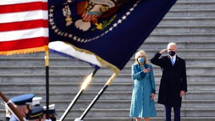 President of the United States Joe Biden salutes as first lady Jill Biden puts her hand on her heart on the east steps of the U.S. Capitol after after the 59th Presidential Inauguration in Washington, U.S., January 20, 2021.  David Tulis/Pool via REUTERS