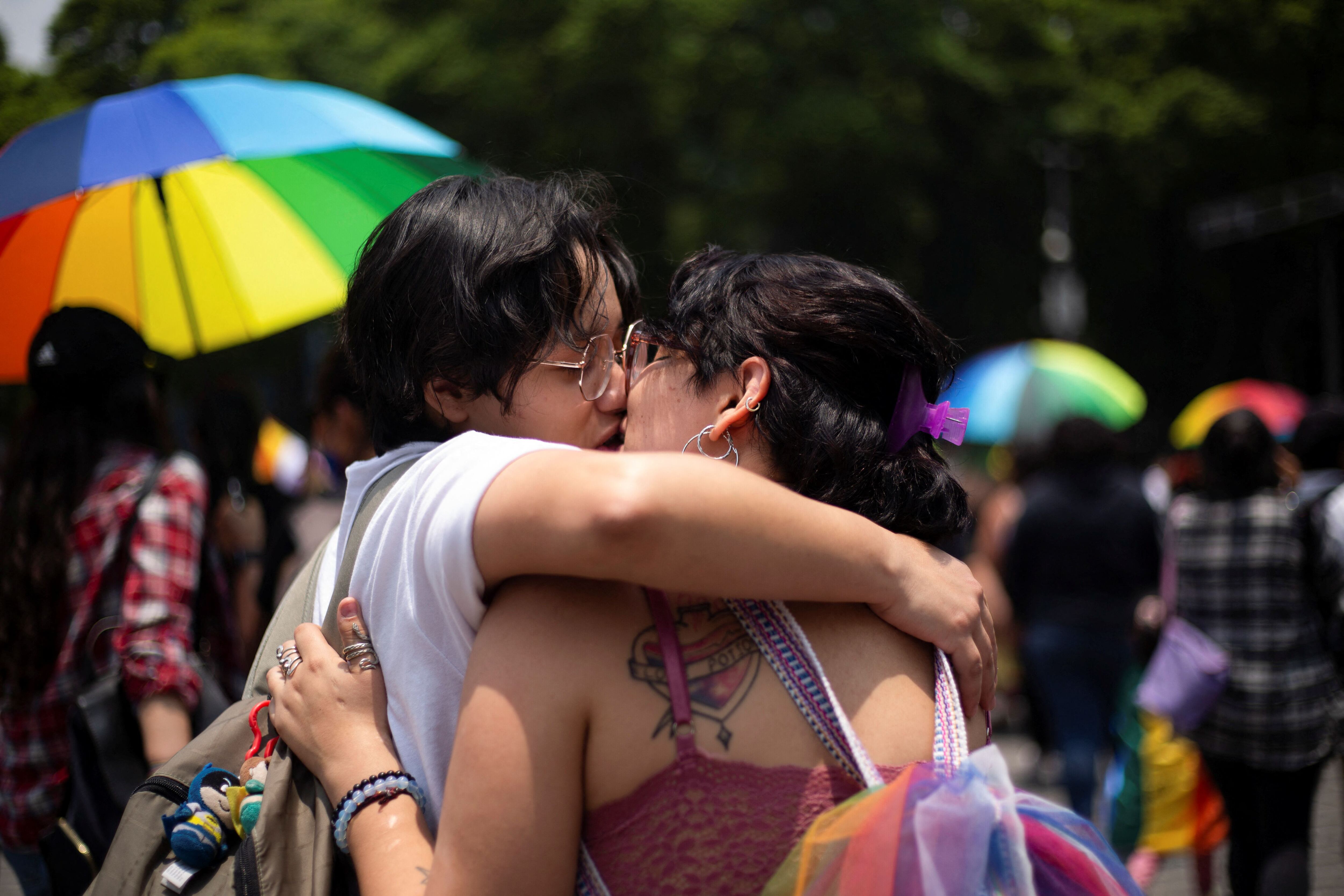 Demonstrators kiss each other during an LGBT protest named "Marcha Lencha 2022" against gender violence and to demand respect for their human rights, in Mexico City, Mexico June 18, 2022. REUTERS/Quetzalli Nicte-Ha