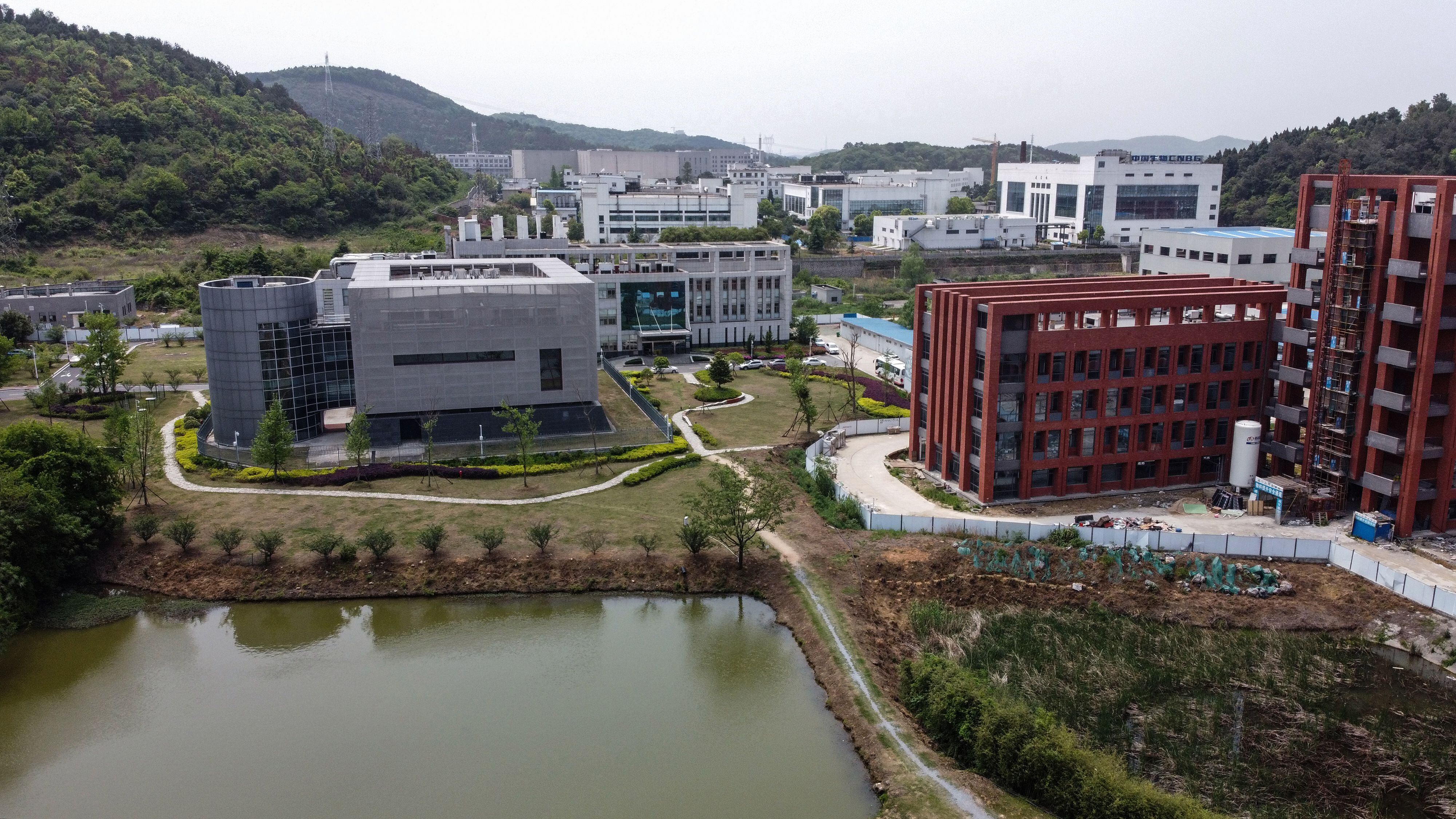 An aerial view shows the P4 laboratory (L) at the Wuhan Institute of Virology in Wuhan in China's central Hubei province on April 17, 2020. - The P4 epidemiological laboratory was built in co-operation with French bio-industrial firm Institut Merieux and the Chinese Academy of Sciences. The facility is among a handful of labs around the world cleared to handle Class 4 pathogens (P4) - dangerous viruses that pose a high risk of person-to-person transmission. (Photo by Hector RETAMAL / AFP)