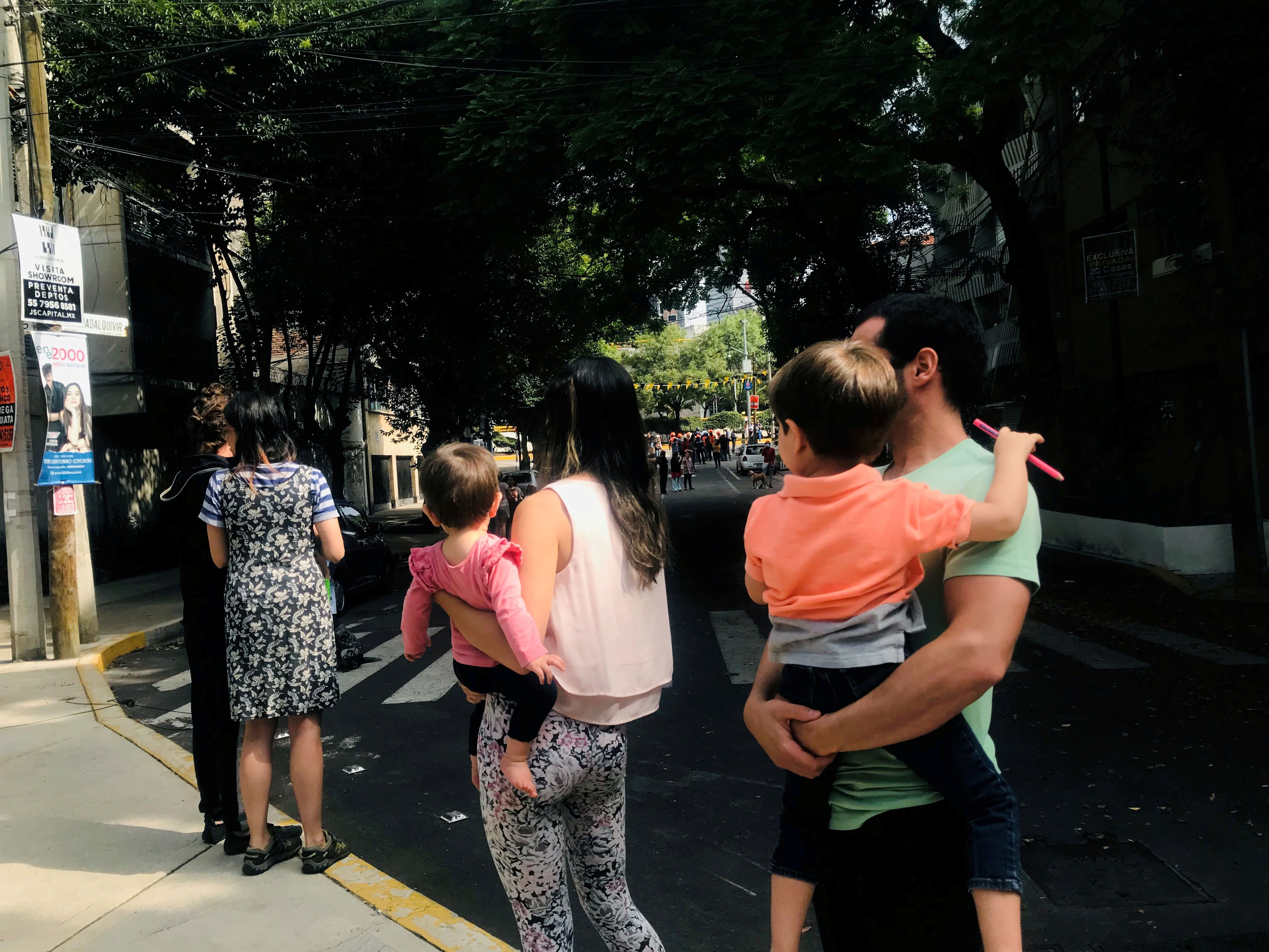 People gather outside their buildings after an earthquake was felt in Mexico City, Mexico June 23, 2020. REUTERS/Henry Romero