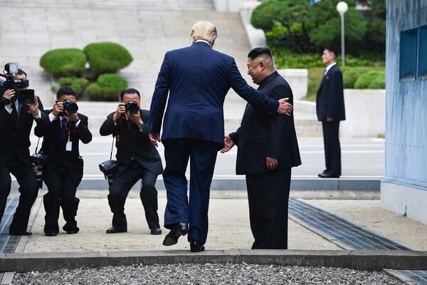 Donald Trump y Kim Jong Un (Photo by Brendan Smialowski / AFP)