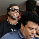 FILE PHOTO: Paraguay police question Ronaldinho over alleged 'adulterated' passport - Paraguayan Public Ministry, Asuncion, Paraguay - March 5, 2020 Ronaldinho leaves the Paraguayan Public Ministry where he testified along with his brother Roberto de Asis REUTERS/Jorge Adorno/File Photo