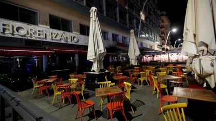 FILE PHOTO: View of a closed restaurant after the southern Italian region of Campania made it mandatory for bars and restaurants to close at 11.00.p.m. (2100GMT), as part of the efforts to contain the coronavirus disease (COVID-19) outbreak, in Naples, Italy October 6, 2020. REUTERS/Ciro De Luca/File Photo