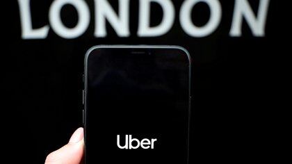 FILE PHOTO: The Uber logo is displayed on a mobile phone in this picture illustration taken November 25, 2019. REUTERS/Hannah McKay/Illustration/File Photo