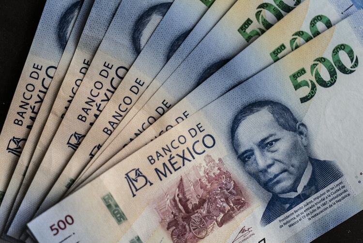 Mexican 500 peso banknotes depicting the image of Benito Juarez, Mexico's former president, are arranged for a photograph in Mexico. Photographer: Cesar Rodriguez/Bloomberg