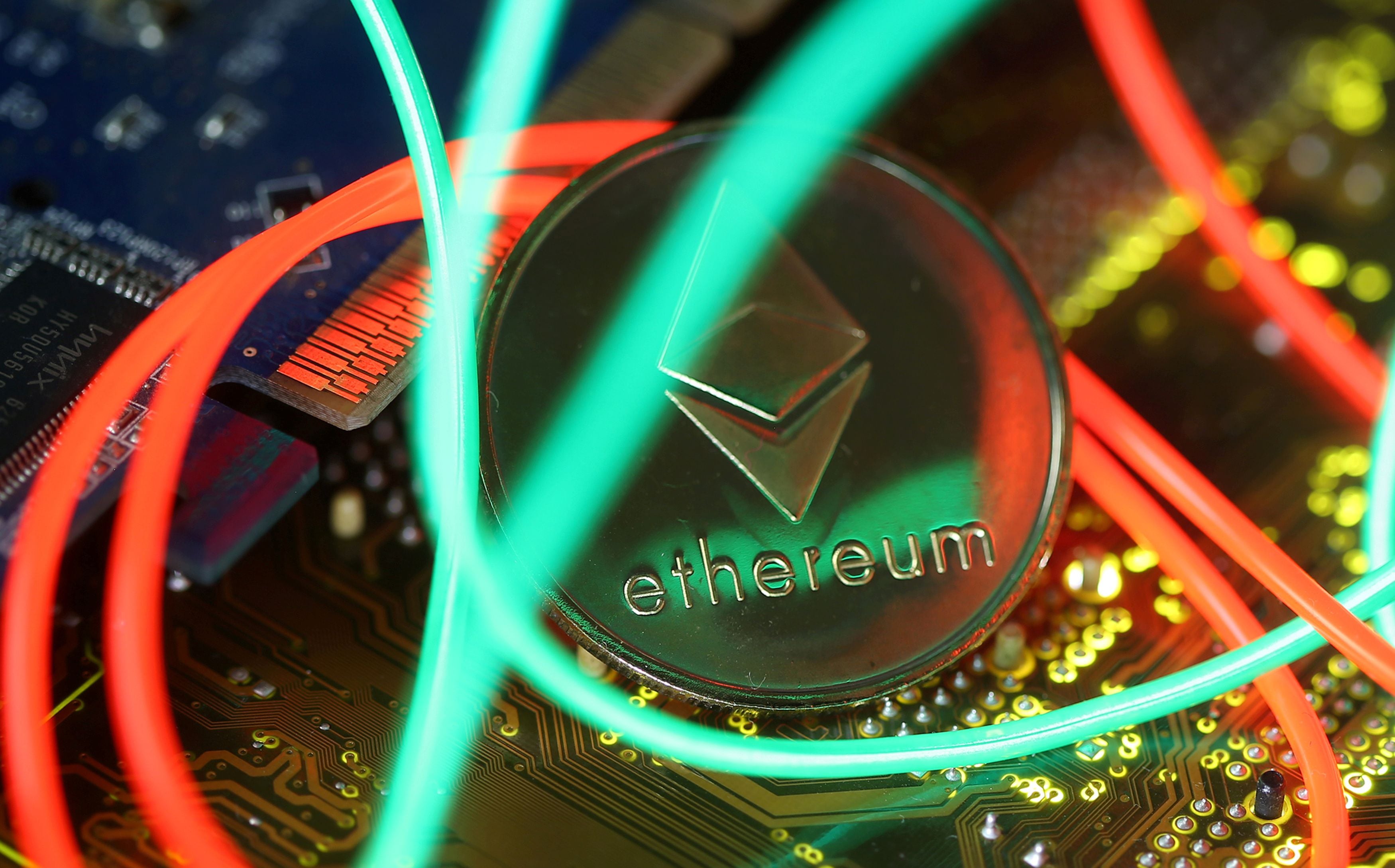 FILE PHOTO: Representation of the Ethereum virtual currency standing on the PC motherboard are seen in this illustration picture, February 3, 2018. REUTERS/Dado Ruvic/Illustration/File Photo