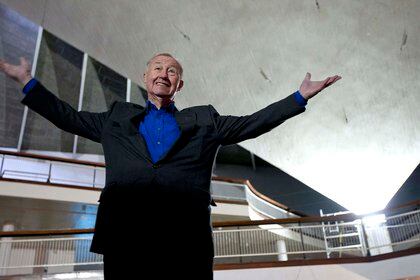 FILE - In this Tuesday, Jan. 24, 2012 file photo, British designer and museum founder Sir Terence Conran poses for photographs during a media event to unveil plans for the new British Design Museum in London. Terence Conran, the pioneering British designer, retailer and restaurateur, has died at age 88. His family said in a statement that Conran died peacefully at his home on Saturday, Sept. 12, 2020. (AP Photo/Matt Dunham, file)