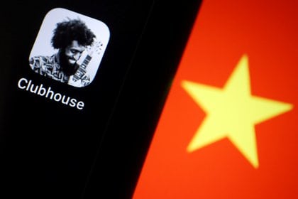 FILE PHOTO: The social audio app Clubhouse is pictured near a star on the Chinese flag in this illustration picture taken February 8, 2021. REUTERS/Florence Lo/Illustration/File Photo