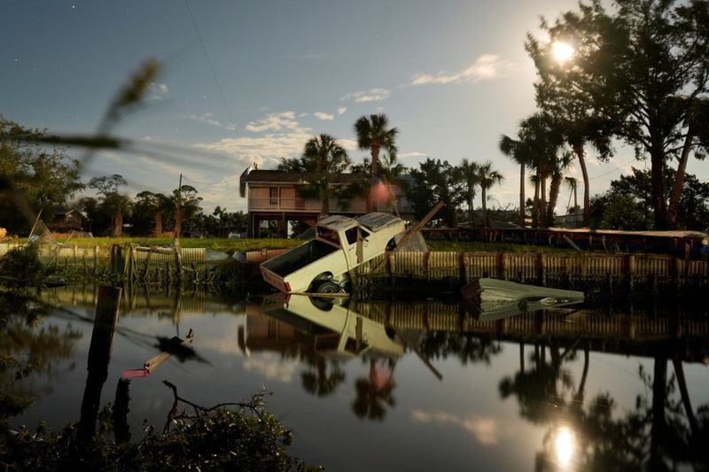 A vehicle in the canal after Hurricane Italia made landfall on Horseshoe Beach, Florida, United States, on August 30, 2023.  REUTERS/Cheney Orr