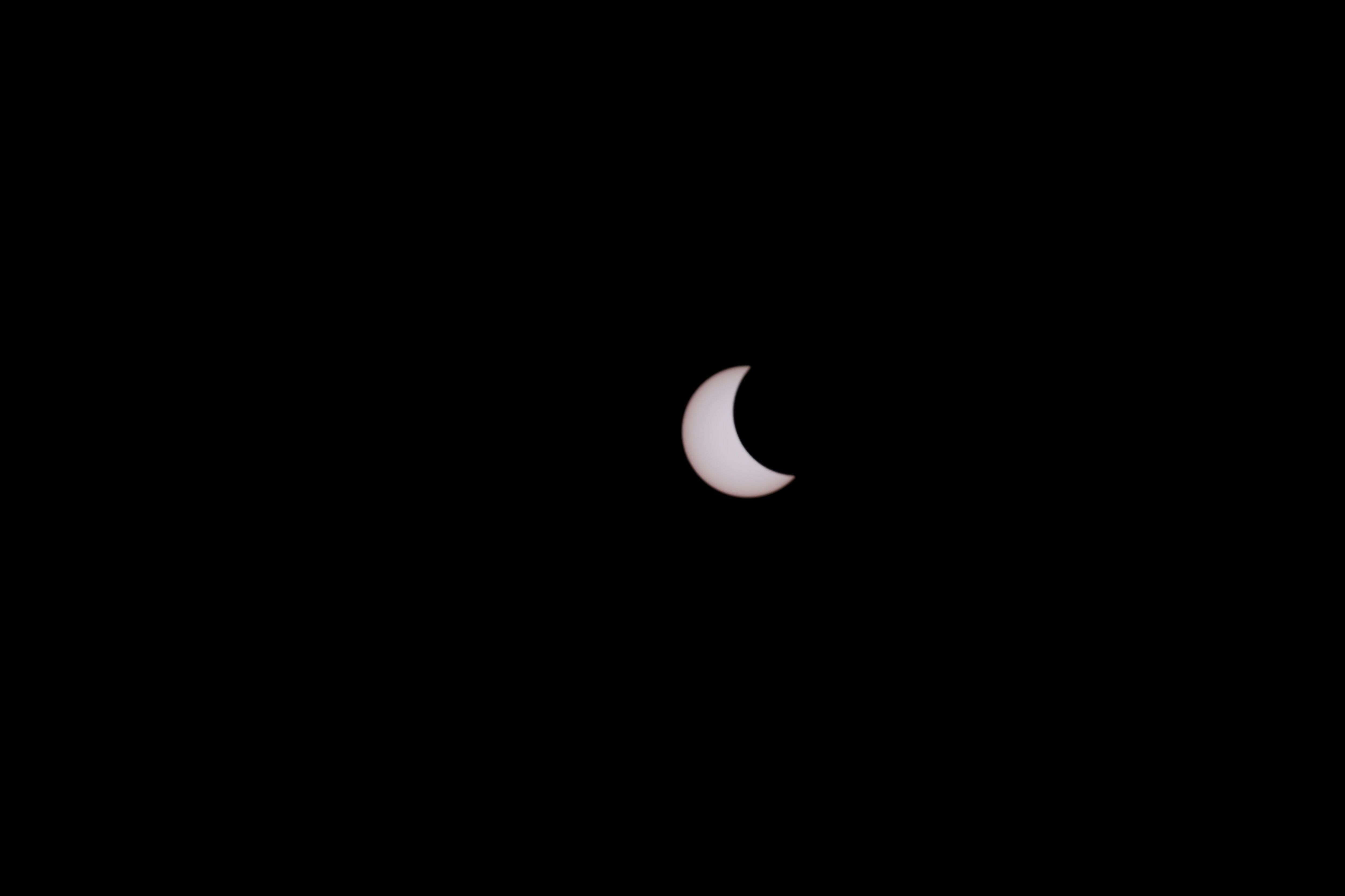 A photo shows a partial solar eclipse observed in Manama, Bahrain, June 21, 2020. REUTERS/Hamad I Mohammed