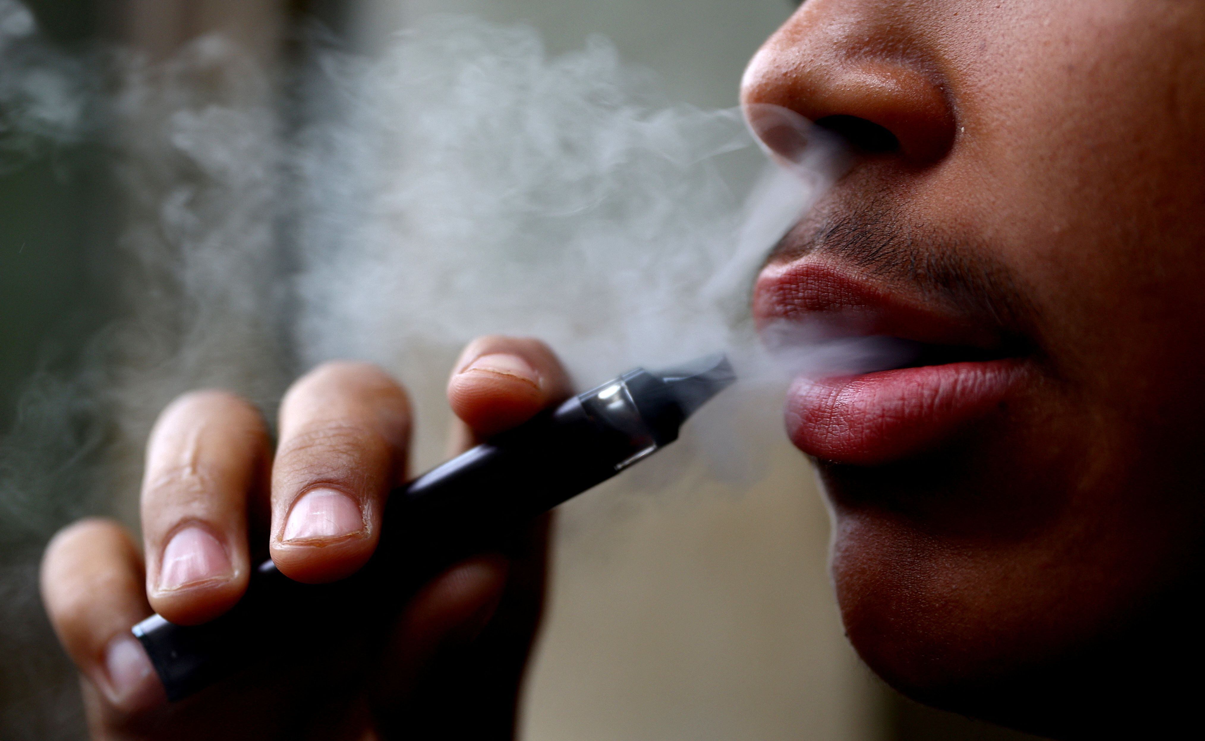 A man smokes a disposable vape, Newcastle-under-Lyme, Britain, September 14, 2023. REUTERS/Carl Recine