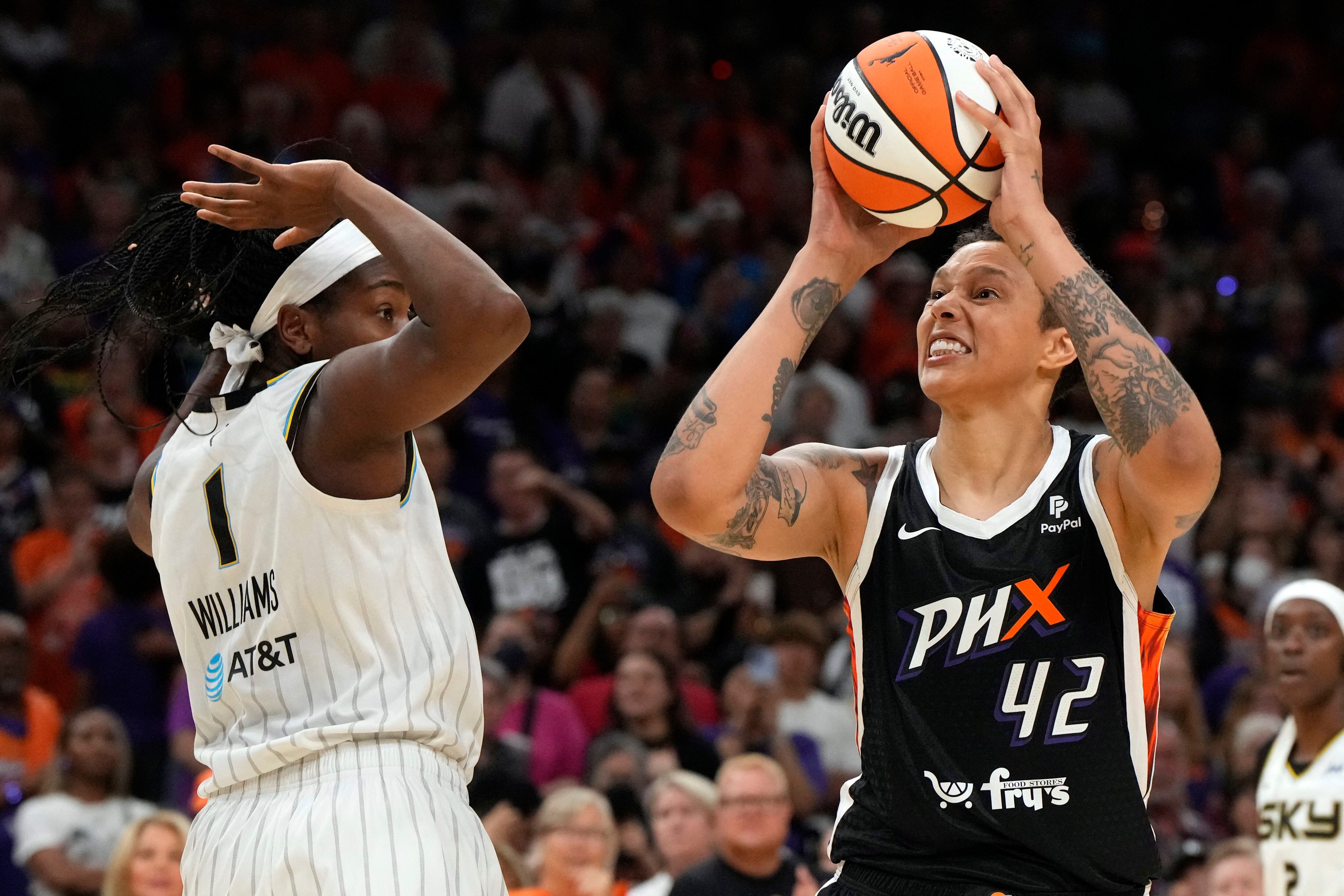 Phoenix Mercury center Brittney Griner moves to the basket against Chicago Sky forward Elizabeth Williams. 