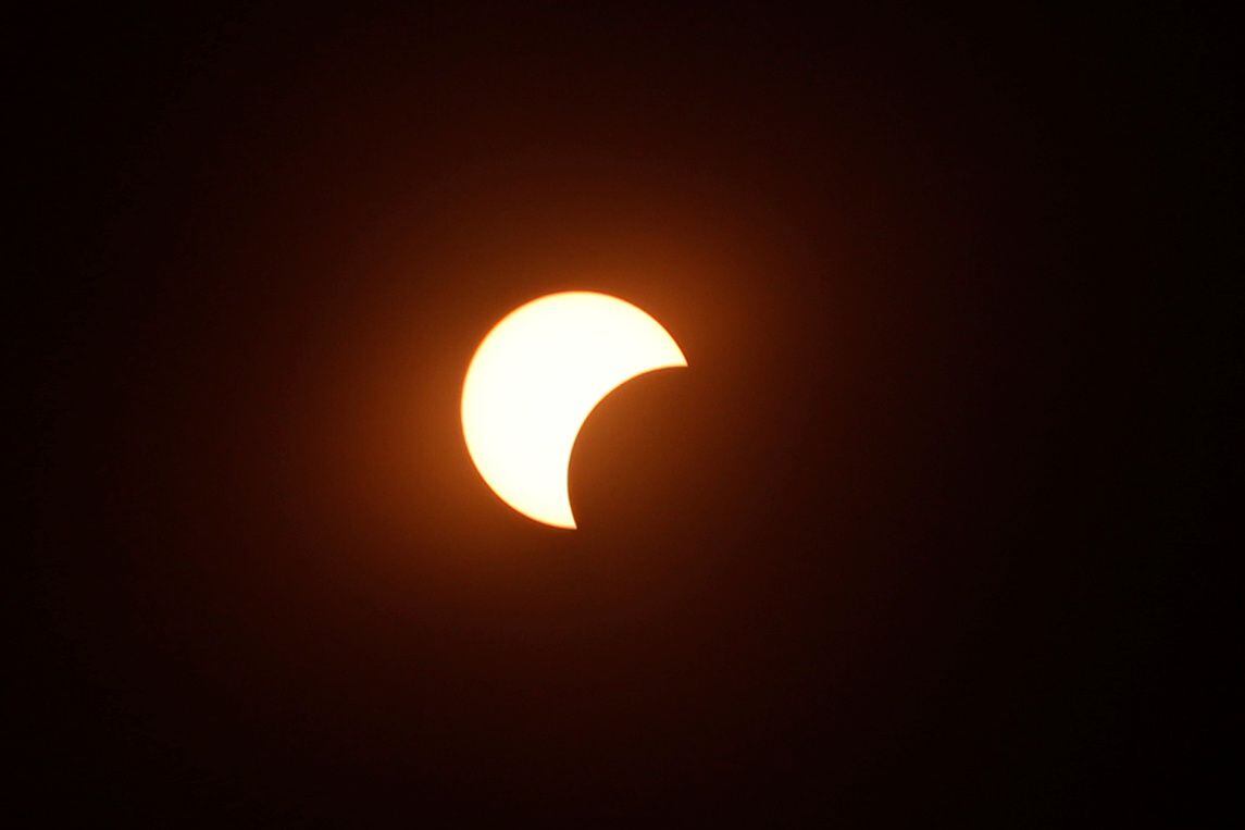 A partial solar eclipse is seen from Mount Scopus in Jerusalem June 21, 2020. REUTERS/Ronen Zvulun
