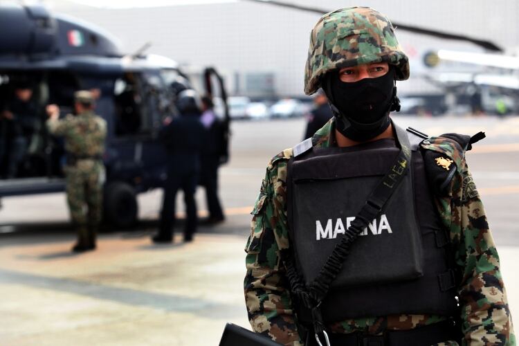 Mandatory Credit: Photo by Jair Cabrera/Nurphoto/Shutterstock (3601811e) A Mexican Navy soldier guards the helicopter containing El Chapo Sinaloa drugs cartel leader Joaquin 'El Chapo' Guzman captured, Mexico City, Mexico - 22 Feb 2014 Mexican President Enrique Pena Nieto on Saturday confirmed the capture of the world's most wanted drug lord, Joaquin Guzman Loera, known as El Chapo, in the Pacific resort of Mazatlan.