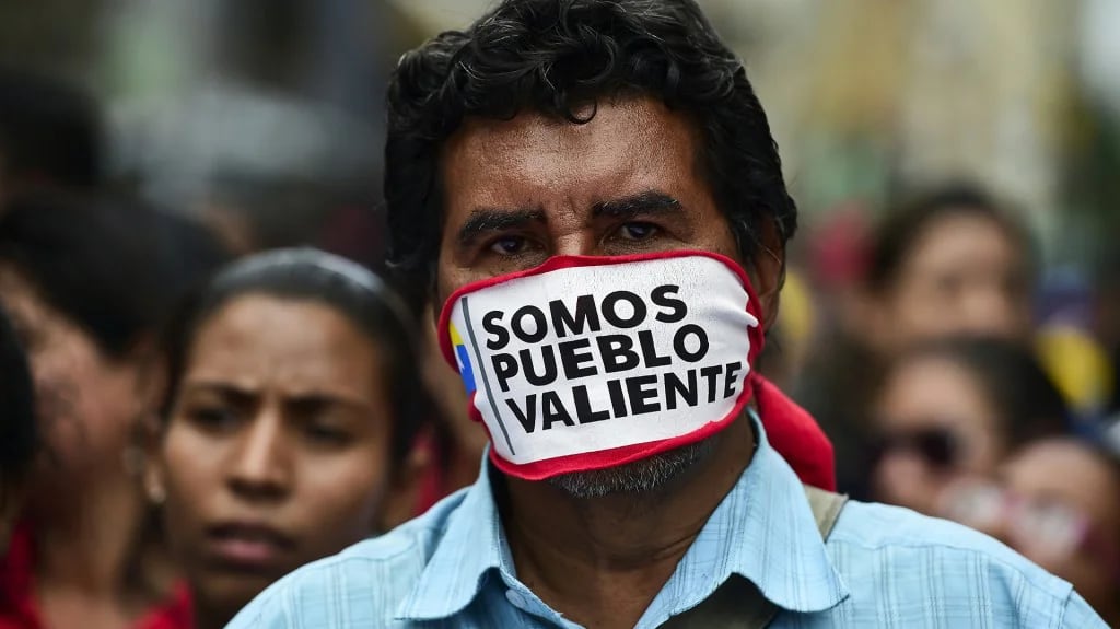 Los venezolanos sufren la crisis en carne propia (AFP)