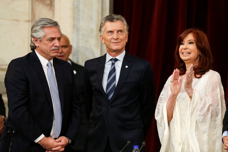 Alberto Fernandez looks on next to new Vice President Cristina Fernandez and Argentina's former President Mauricio Macri, after he sworn in as Argentina's new President, at the National Congress, in Buenos Aires, Argentina December 10, 2019. REUTERS/Agustin Marcarian