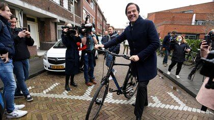 Dutch Prime Minister Mark Rutte of the VVD Liberal party reacts as he walks during the Dutch general election, in The Hague, Netherlands, March 17, 2021. REUTERS/Piroschka Van De Wouw
