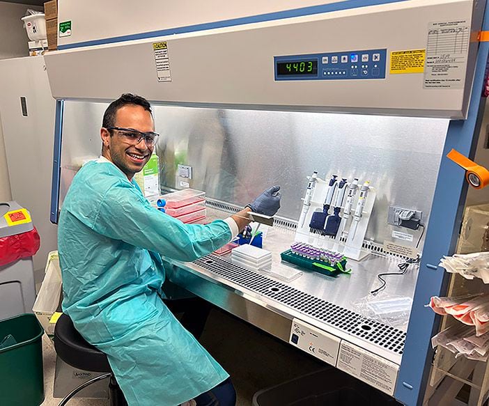 Biochemistry graduate student Amin Addetia conducting Omicron variant vaccine-elicited immunity and immune evasion research in the Veesler Lab at the University of Washington School of Medicine.  CREDIT Veesler Lab/UW Medicine