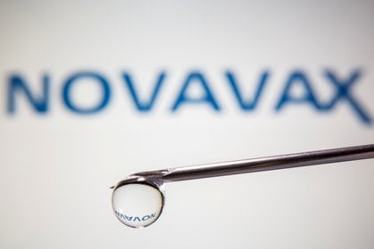 FILE PHOTO: A Novavax logo is reflected in a drop on a syringe needle in this illustration taken November 9, 2020. REUTERS/Dado Ruvic/Illustration/File Photo