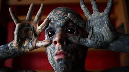 French primary school teacher and tattoo enthusiast Sylvain Helaine, known as Freaky Hoody, poses during a photo session in Palaiseau, a south of Paris suburb, on September 22, 2020. (Photo by Christophe ARCHAMBAULT / AFP)