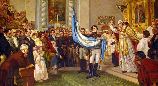 Juan Ignacio Gorriti bendice la bandera, que sostiene Belgrano. Fue en la catedral de San Salvador de Jujuy (Oleo de Luigi de Servi)