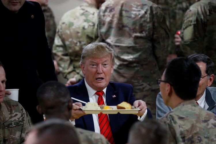 Donald Trump traveled by surprise to Afghanistan to share Thanksgiving dinner with US troops