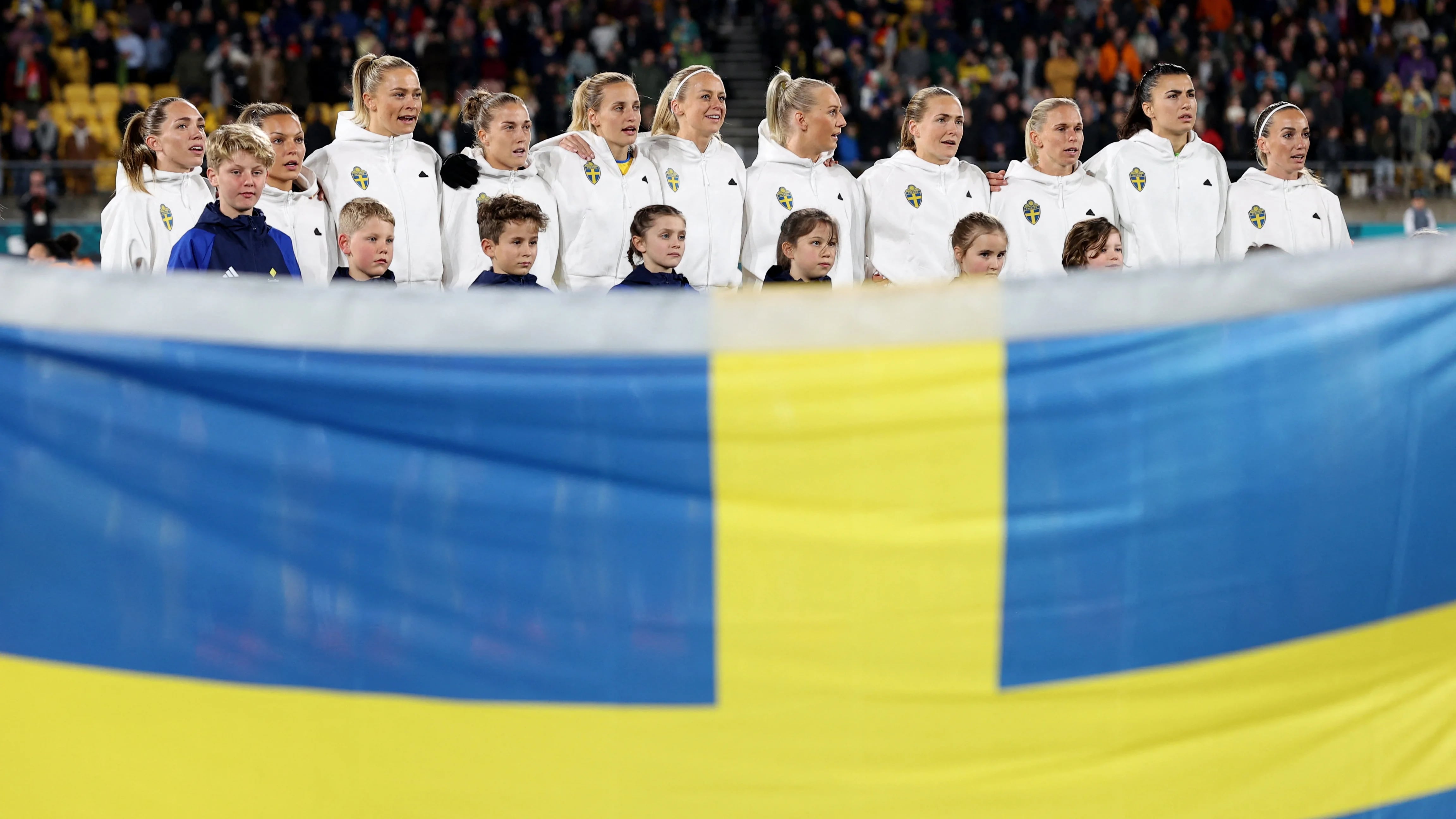 Soccer Football - FIFA Women’s World Cup Australia and New Zealand 2023 - Group G - Sweden v Italy - Wellington Regional Stadium, Wellington, New Zealand - July 29, 2023 Sweden players line up during the national anthems before the match REUTERS/Amanda Perobelli
