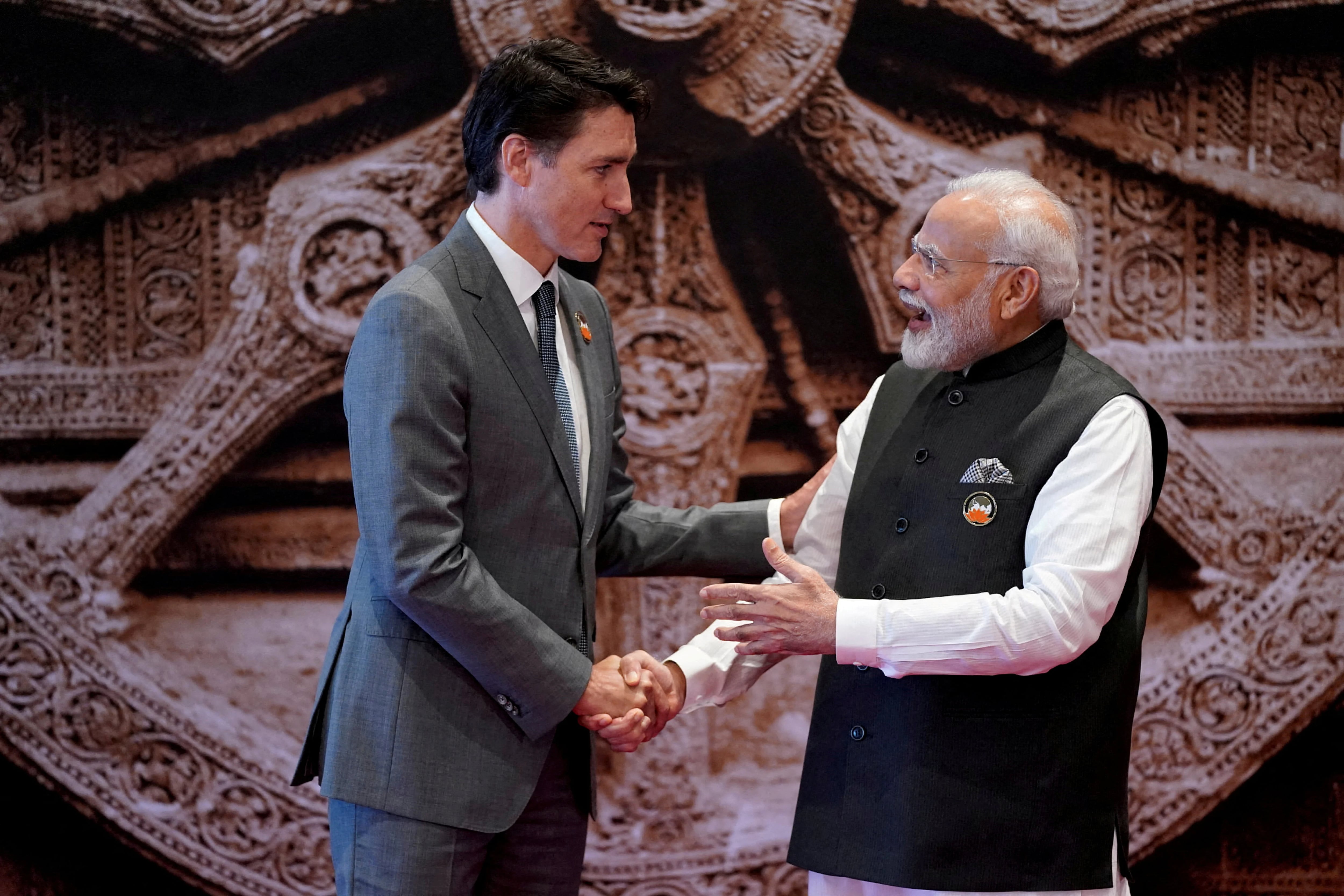FILE PHOTO: Indian Prime Minister Narendra Modi welcomes Canada Prime Minister Justin Trudeau upon his arrival at Bharat Mandapam convention center for the G20 Summit, in New Delhi, India, Saturday, Sept. 9, 2023. Evan Vucci/Pool via REUTERS//File Photo