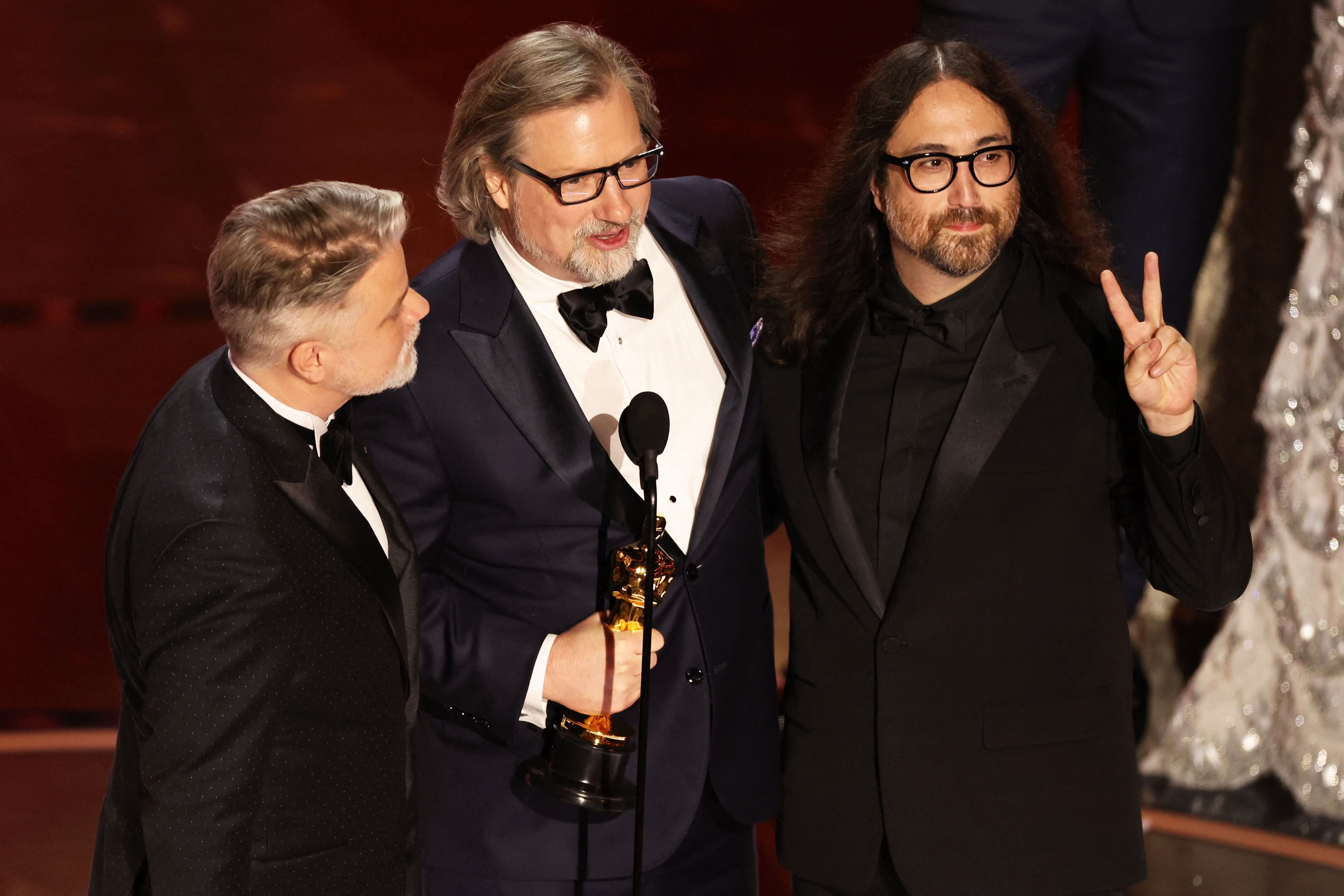 Dave Mullins and Brad Booker win the Oscar for Best Animated Short Film for "War Is Over! Inspired by the Music of John & Yoko" during the Oscars show at the 96th Academy Awards in Hollywood, Los Angeles, California, U.S., March 10, 2024. REUTERS/Mike Blake