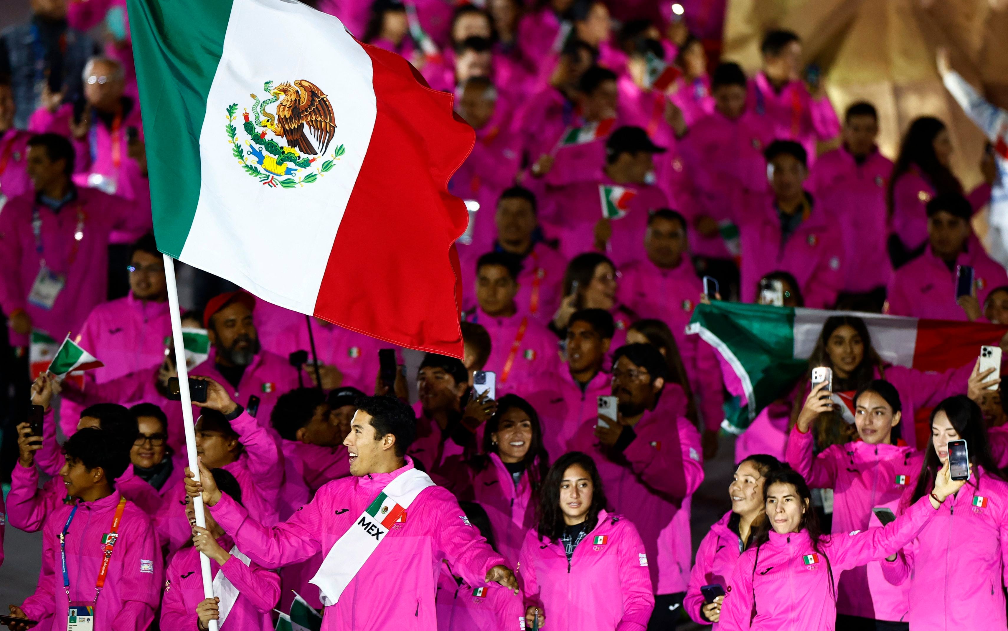 Pan-Am Games - Santiago 2023 - Opening Ceremony - Estadio Nacional, Santiago, Chile - October 20, 2023 Flag bearers Karina Esquer and Carlos Sansores lead the Mexico contingent during the athletes parade at the Opening Ceremony REUTERS/Agustin Marcarian