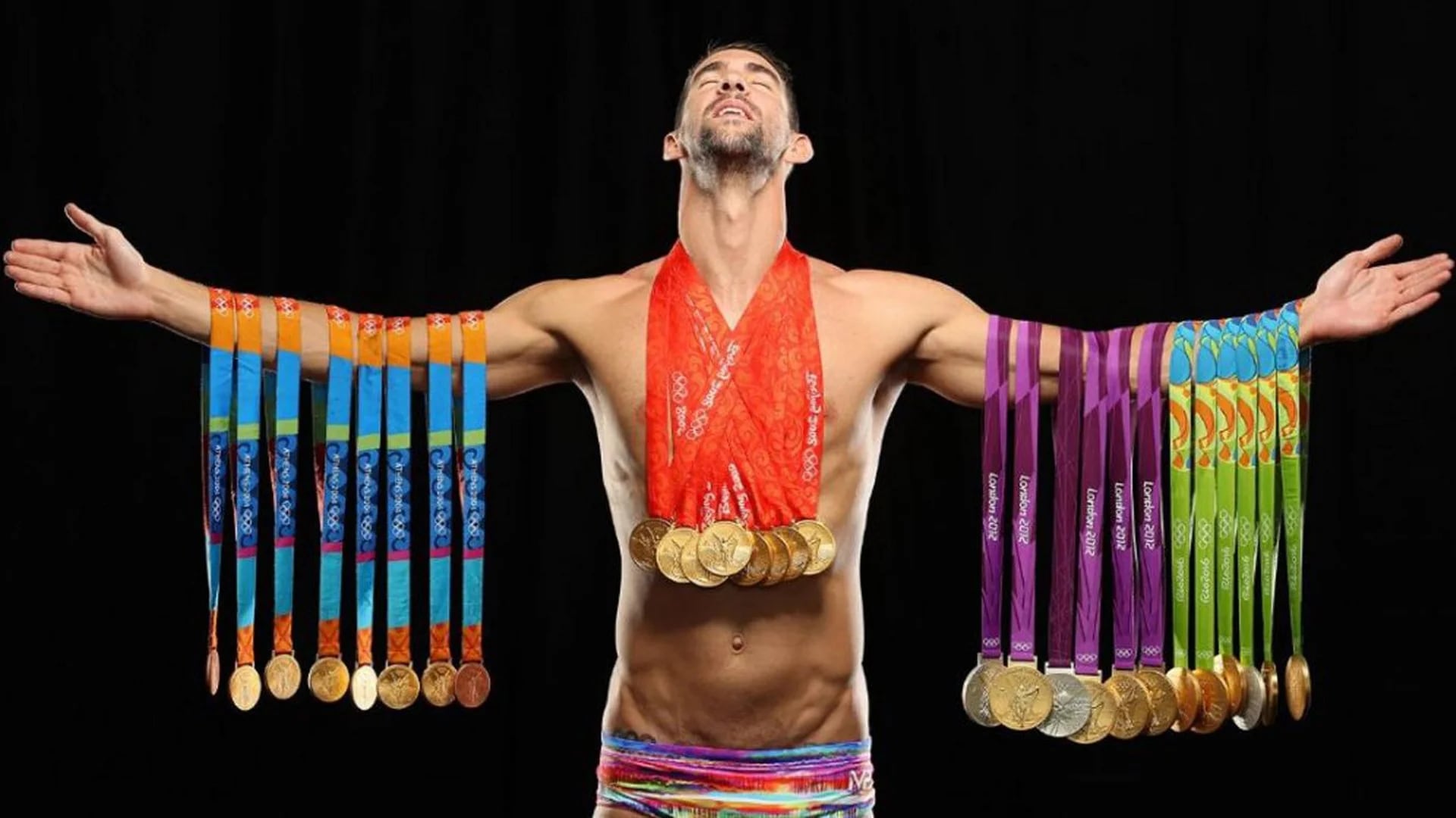 Michael Phelps con todas sus medallas olímpicas (Sports Illustrated)