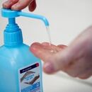 An employee uses hydroalcoholic gel at the Christeyns company's factory in this illustration picture in Vertou near Nantes, France, March 6, 2020. REUTERS/Stephane Mahe/Illustration