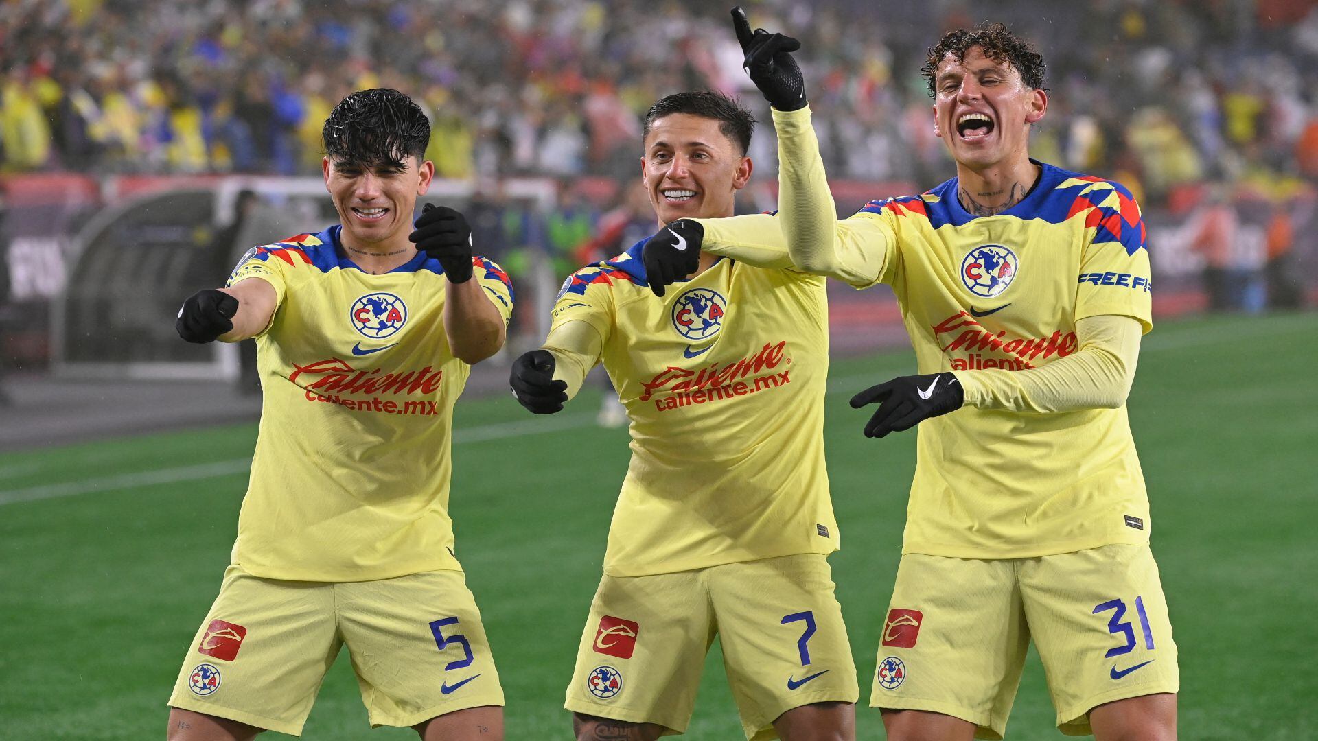 Apr 2, 2024; Foxborough, MA, USA; Club America forward Brian Rodriguez (7) celebrates his goal against the New England Revolution with teammates defender Kevin Alvarez (5) and defender Igor Lichnovsky (31) during the second half at Gillette Stadium. Mandatory Credit: Eric Canha-USA TODAY Sports