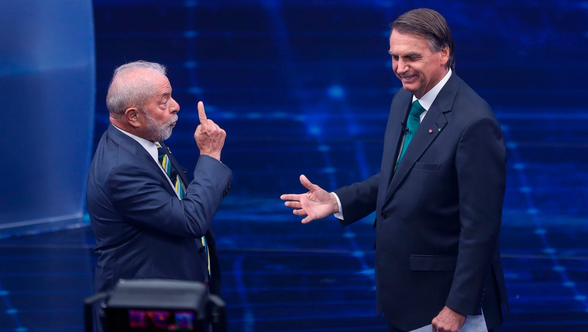 FILE - Brazil's former President Luiz Inacio Lula da Silva, left, and incumbent Jair Bolsonaro, take part in a presidential debate in Sao Paulo, Brazil, Oct. 16, 2022. During the first segment of their first one-on-one debate, they sought to convince poor voters that welfare payments will remain at their value. (AP Photo/Marcelo Chello, File)