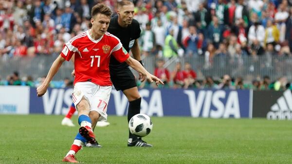 Russia’s Alexander Golovin scores his sides 5th goal from a direct free kick during the group A match between Russia and Saudi Arabia which opens the 2018 soccer World Cup at the Luzhniki stadium in Moscow, Russia, Thursday, June 14, 2018. (AP Photo/Antonio Calanni)