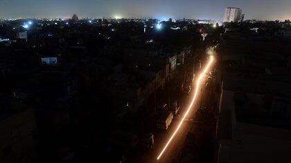 A general view shows Pakistan's port city of Karachi during a power blackout early on January 10, 2021. (Photo by Asif HASSAN / AFP)