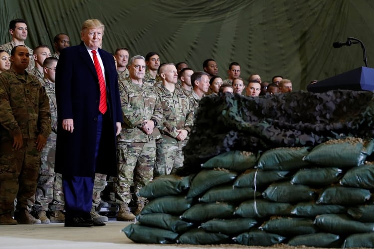 Donald Trump traveled by surprise to Afghanistan to share Thanksgiving dinner with US troops