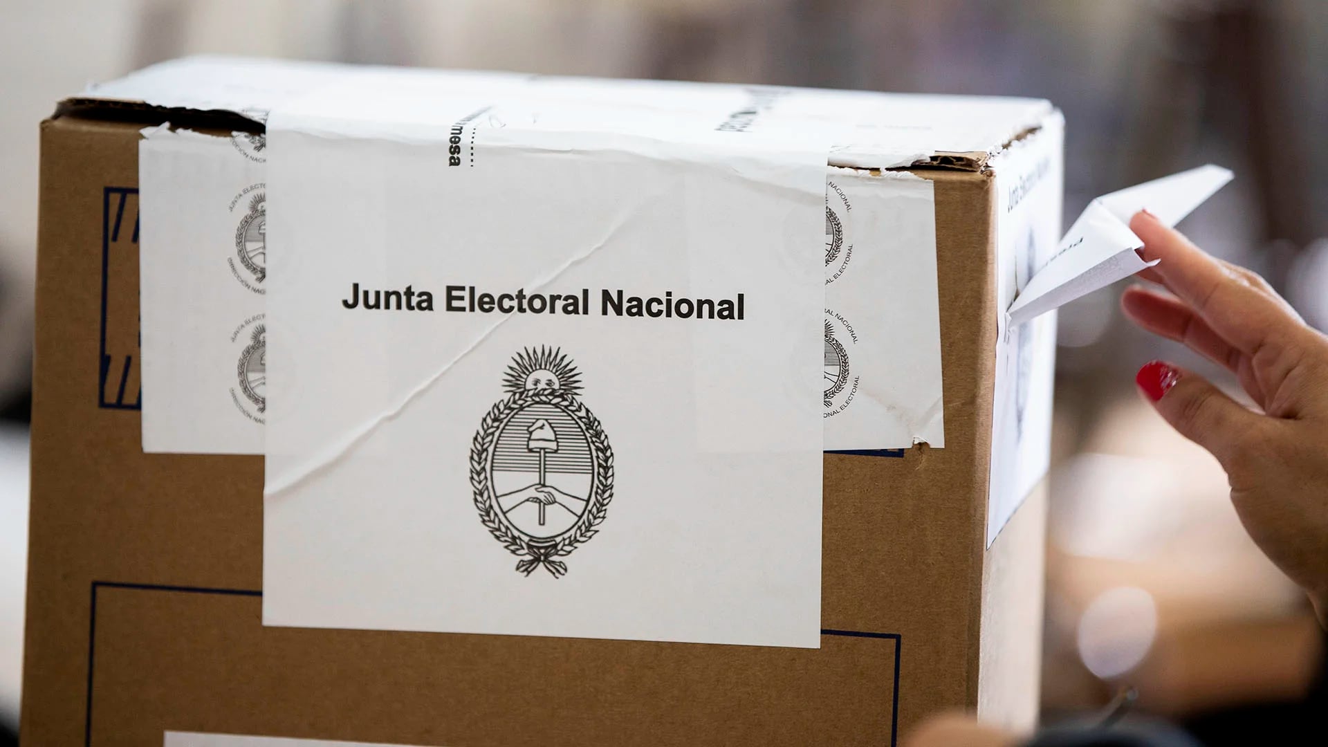 A woman casts her vote at a polling during primary elections in Buenos Aires, Argentina, Sunday, Aug. 11, 2019. Argentina is holding primary elections Sunday which are expected to provide a hint of who might win ahead of October's presidential elections. (AP Photo/Tomas F. Cuesta)