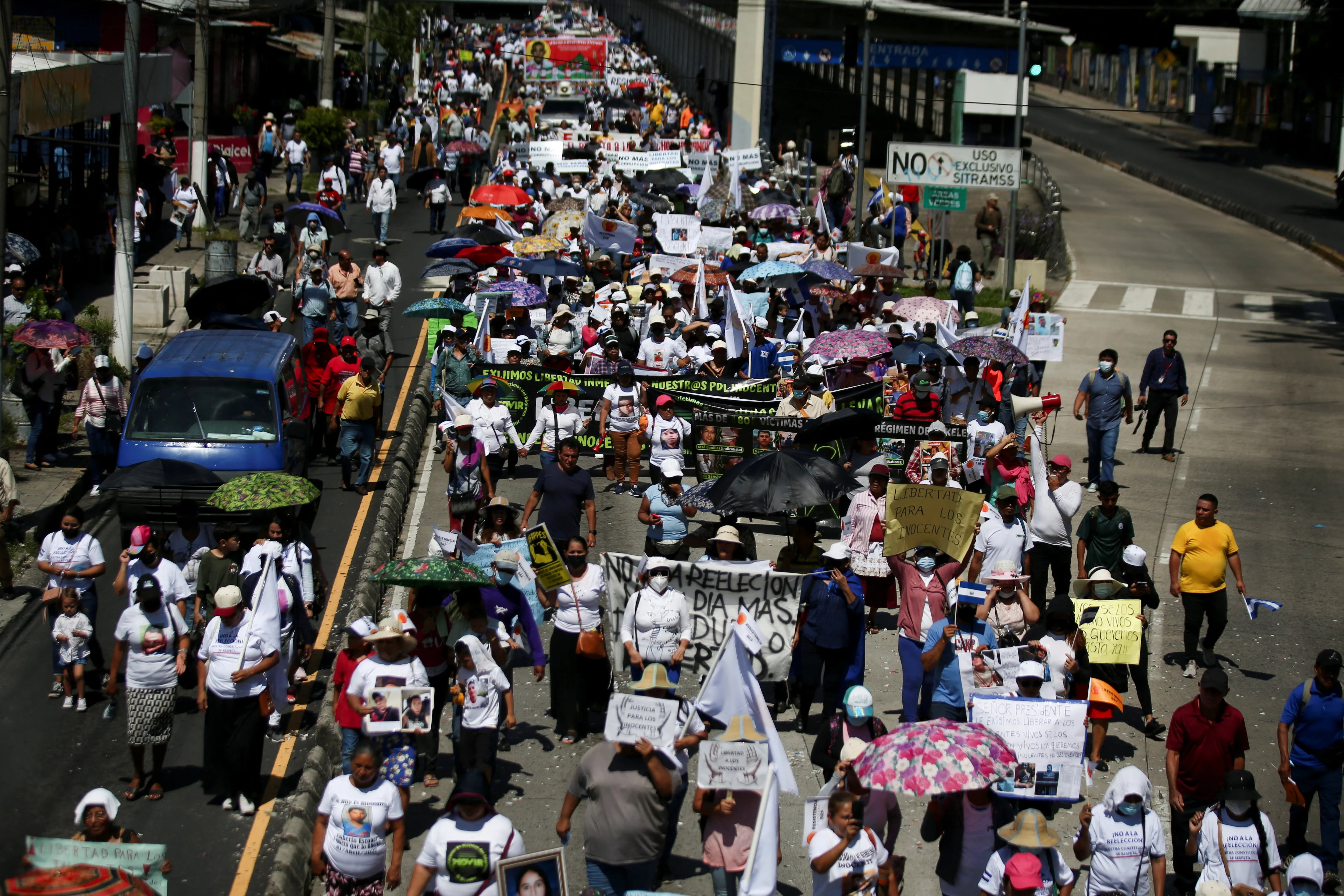 People participate in a protest against the re-election of El Salvador's President Nayib Bukele and against the detention of innocent people during the government's state of emergency to curb gang violence, in San Salvador, El Salvador September 15, 2023. REUTERS/Jose Cabezas